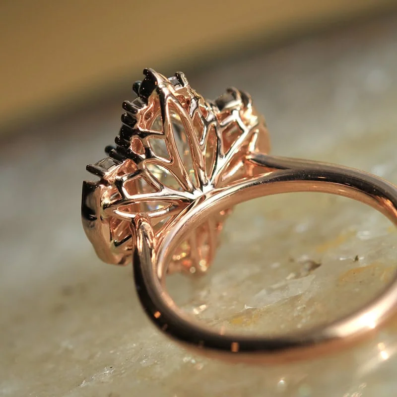 Rose gold engagement ring with intricate openwork setting
