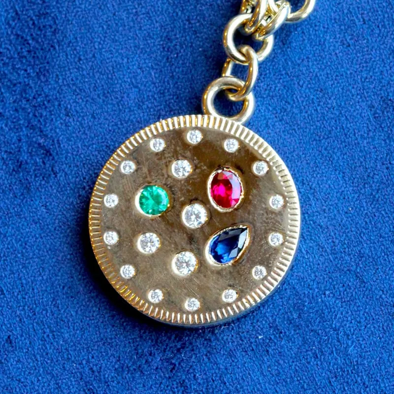 Gold pendant necklace with diamonds and colorful gemstones