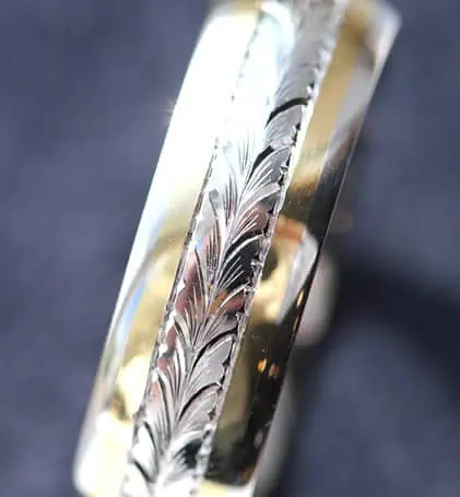 Gold wedding band with engraved pattern