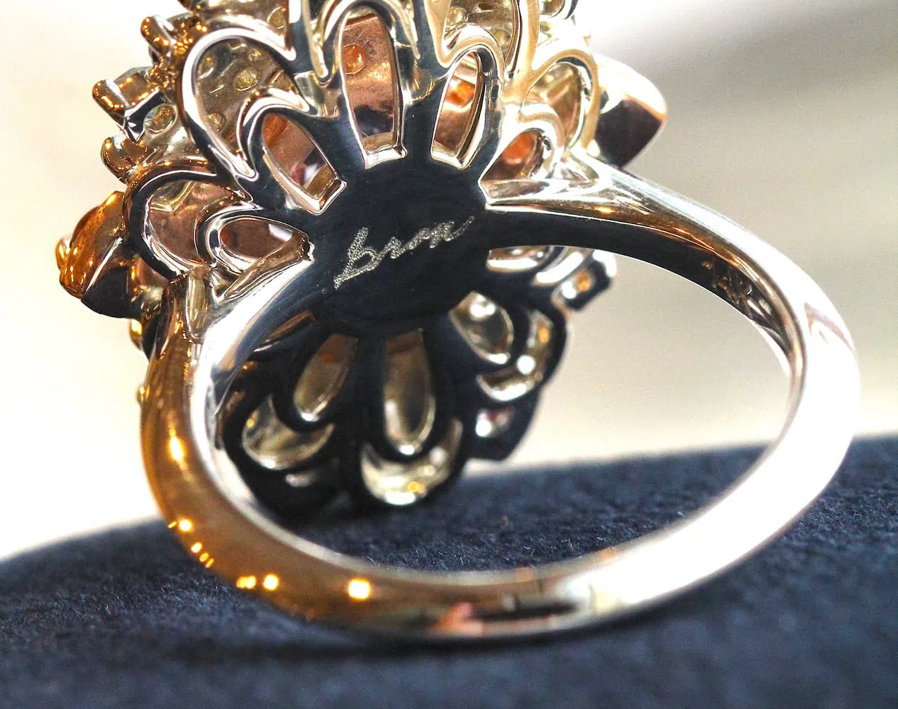 Underside view of a custom ring setting showing detailed metalwork beneath the gemstone