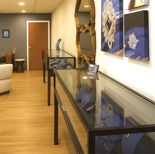 Jewelry showroom display cases with custom jewelry pieces and gemstone designs