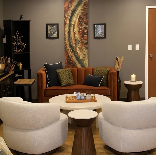 Comfortable jewelry consultation area with seating where clients review gemstones and custom designs