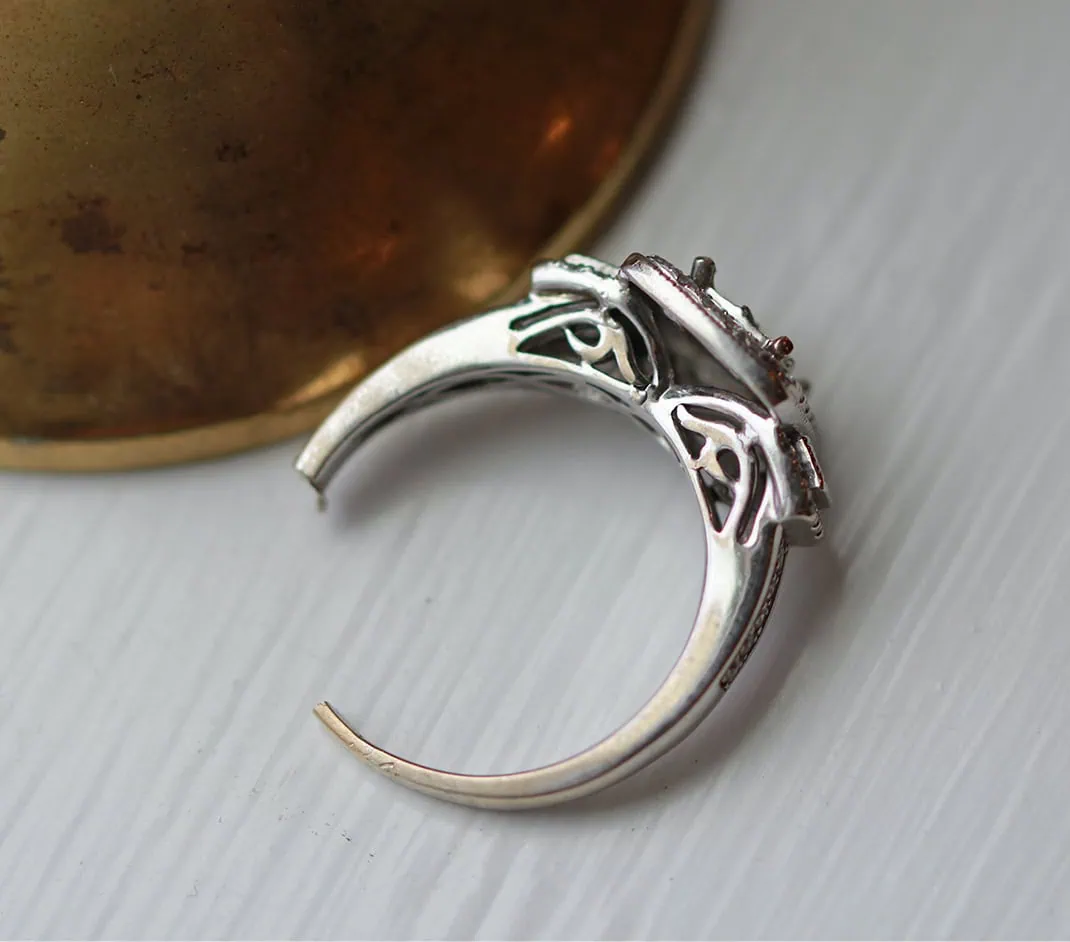 White gold ring shown from the side during the jewelry repair process